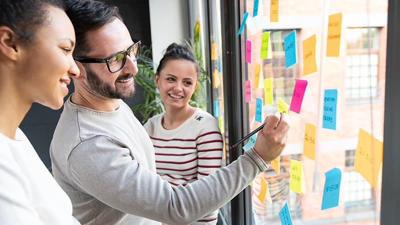 people planning with sticky notes
