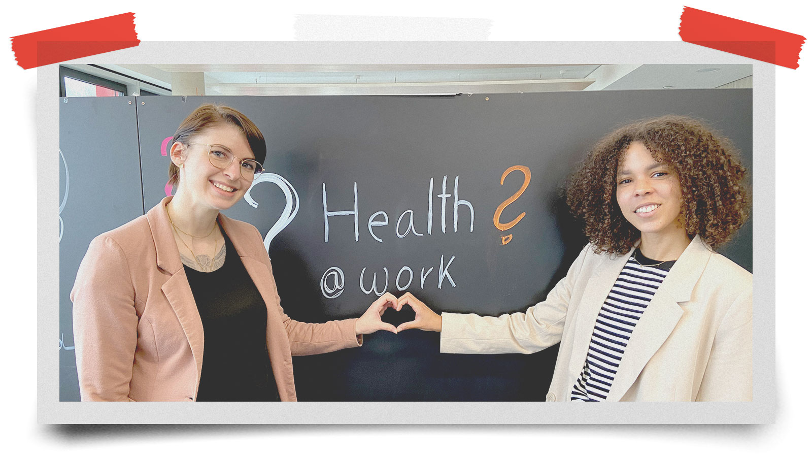 employees forming love heart symbol with their hands