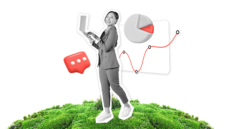 woman on laptop in front of foliage