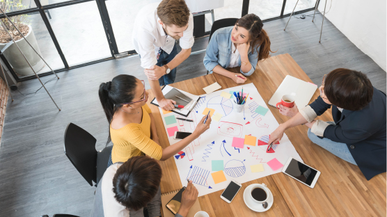 table of engaged individuals developing learning