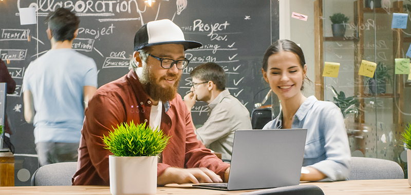two colleagues discussing digital platform