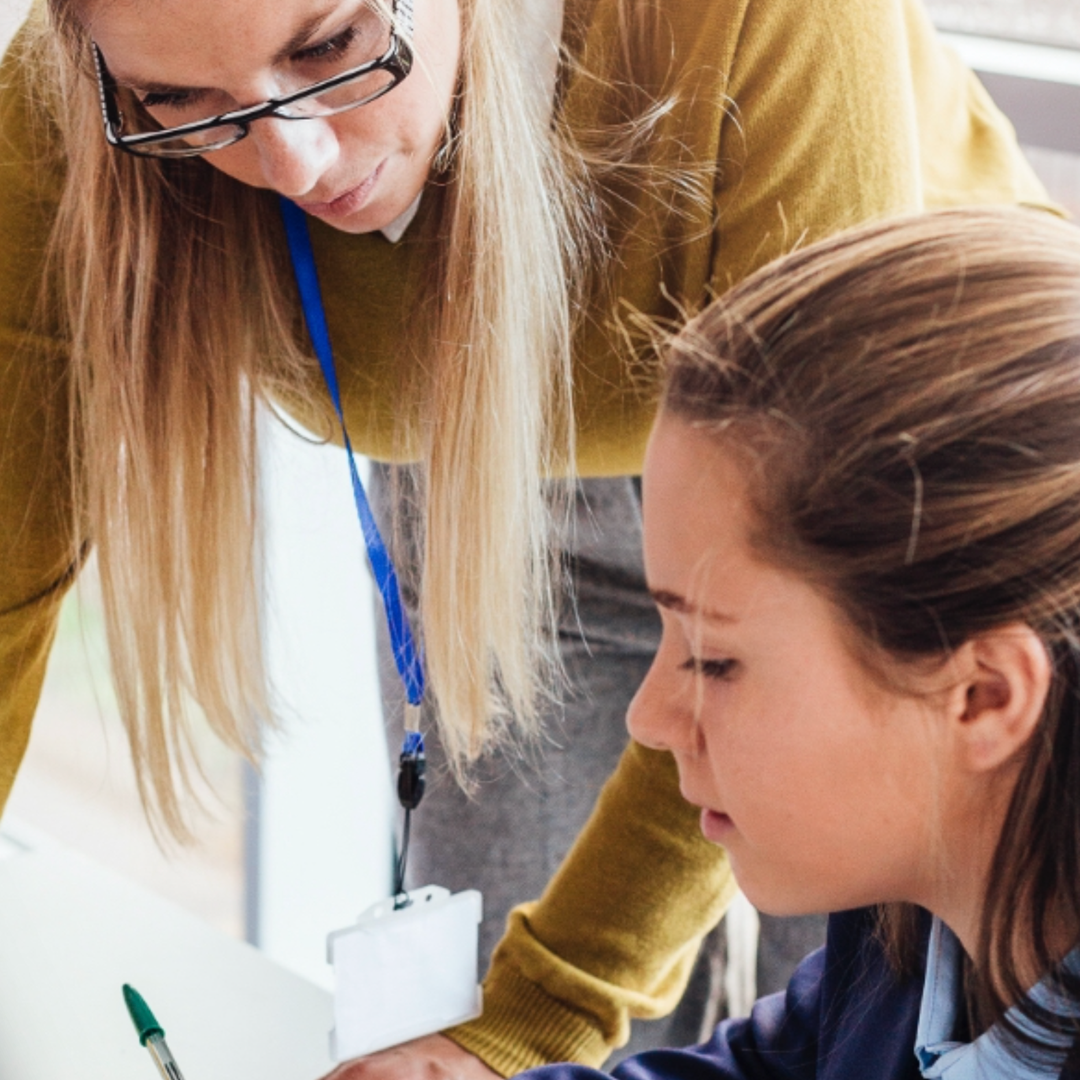 teacher interacting with student