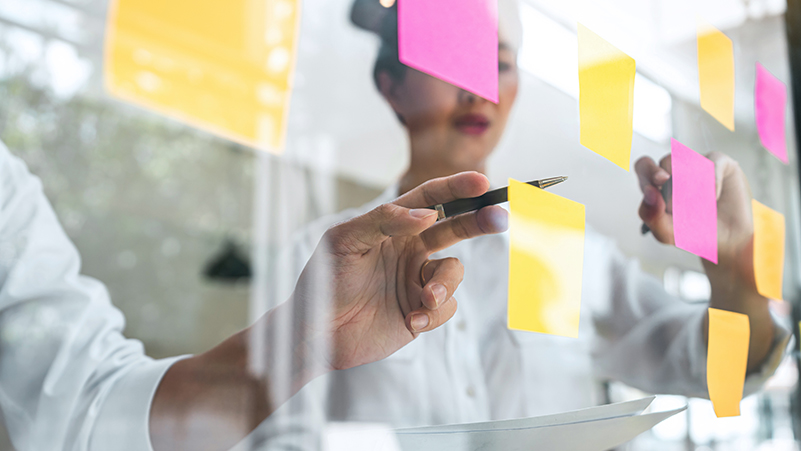 people planning with sticky notes