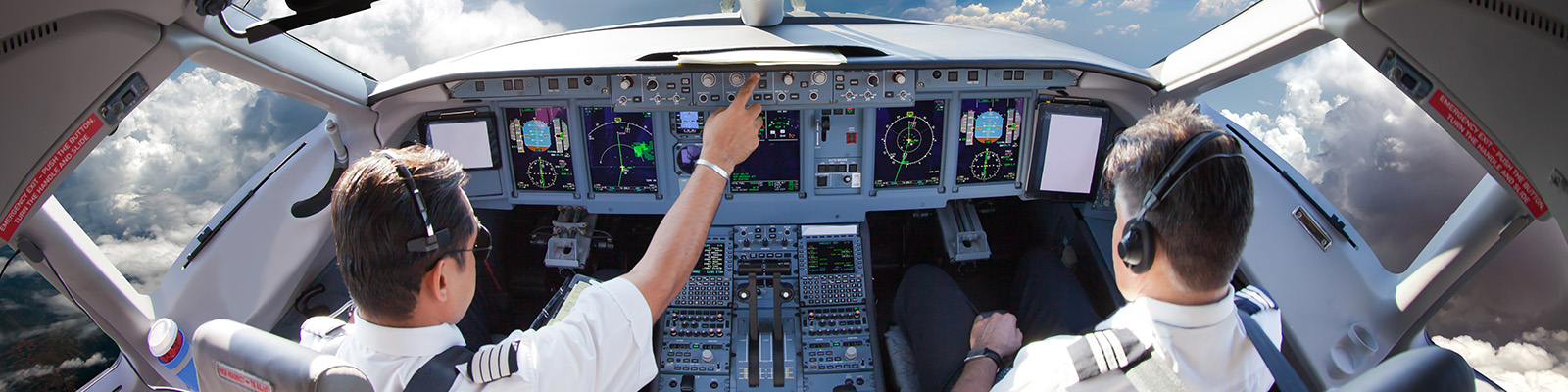 photo of pilots in plane cockpit