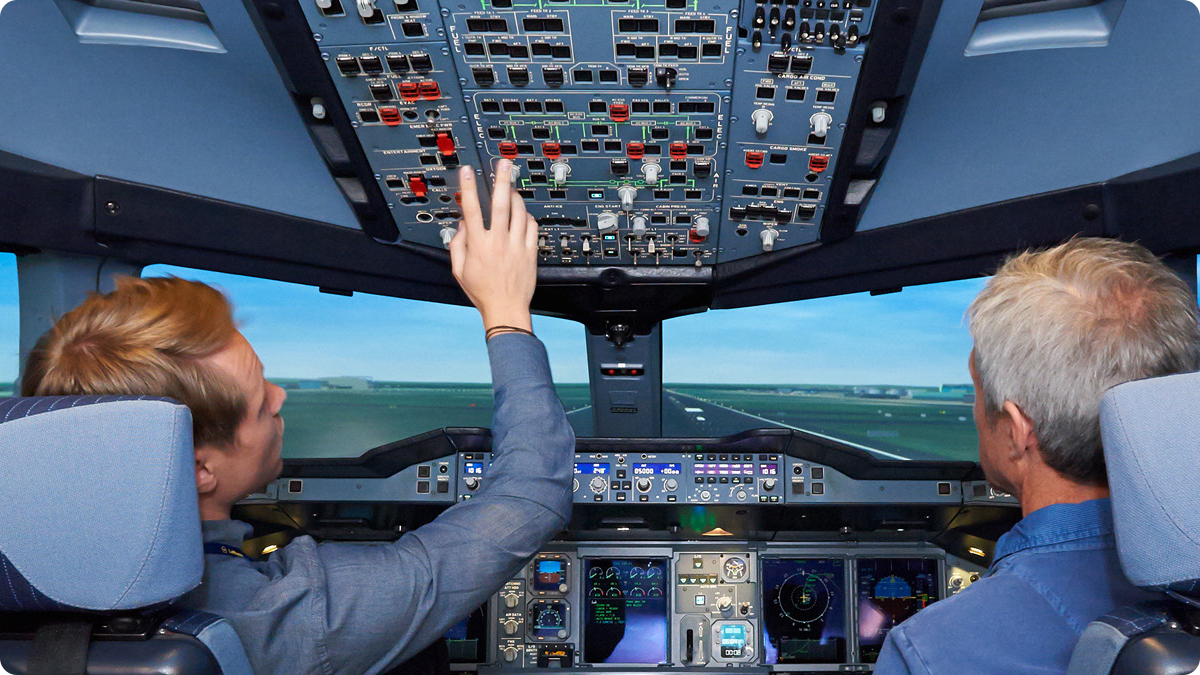 photo of pilots in plane cockpit