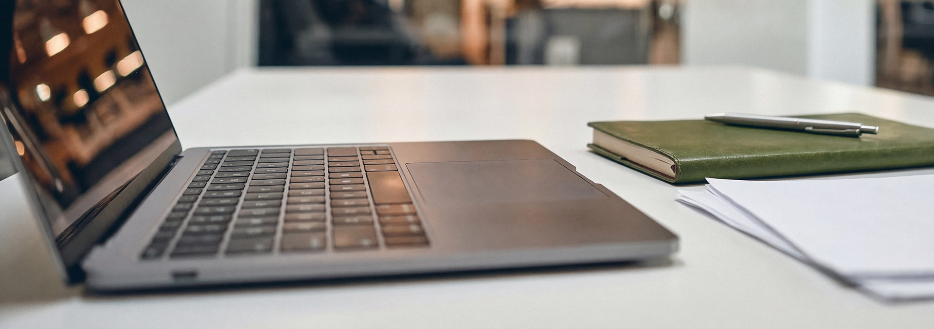 Laptop and notepad on a desk