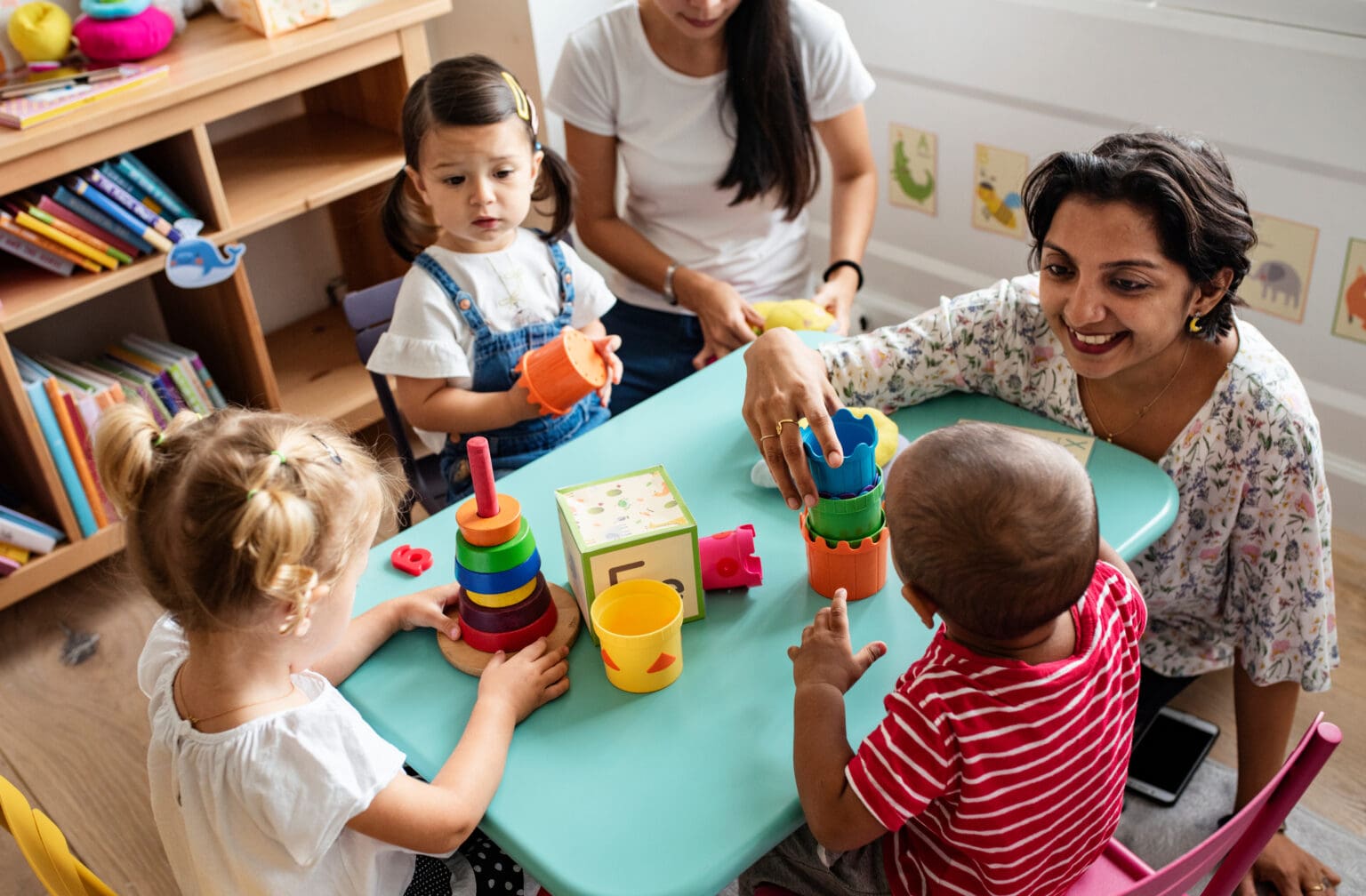 EYA Image of caregiver with children at play