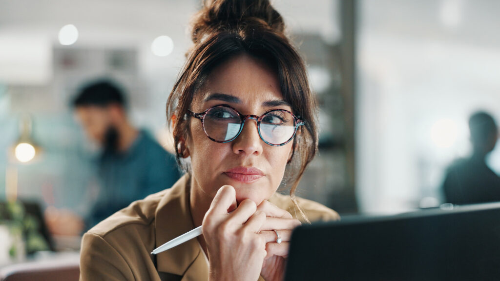 Person thinking to themselves at desk